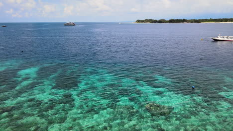 Boats,-Yacht,-And-Buoys-Floating-In-The-Sea-In-Bali,-Indonesia-On-A-Sunny-Day