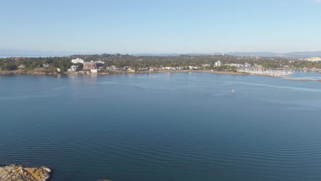 Drone-over-the-Pacific-towards-Oak-Bay-BC,-Canada