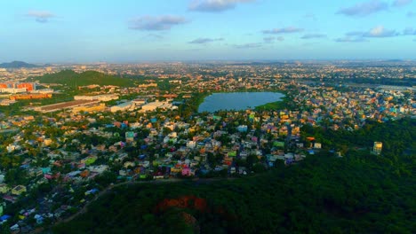 Drone-shot-moving-forwards-giving-a-birds-eye-view-of-a-city