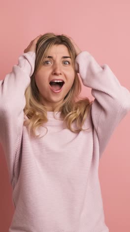 blonde young caucasian woman gesturing surprise