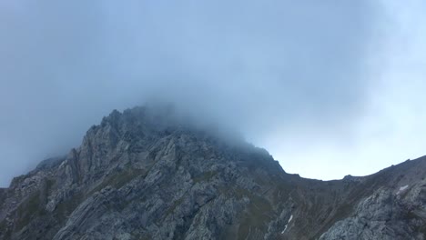 close view of moutain peak tajakopf covered in clouds