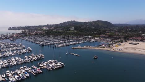 aerial view of a bustling marina and beach