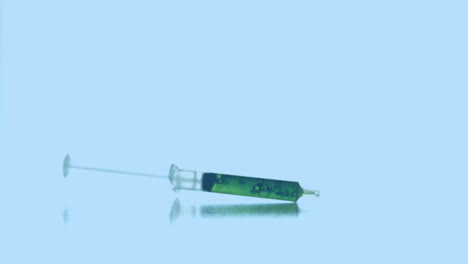 Animation-of-molecules-floating-over-syringe-with-reagent-falling-on-blue-background