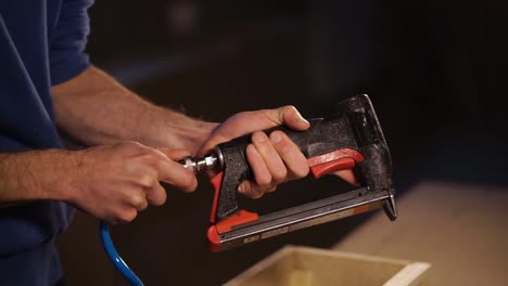 person using a nail gun