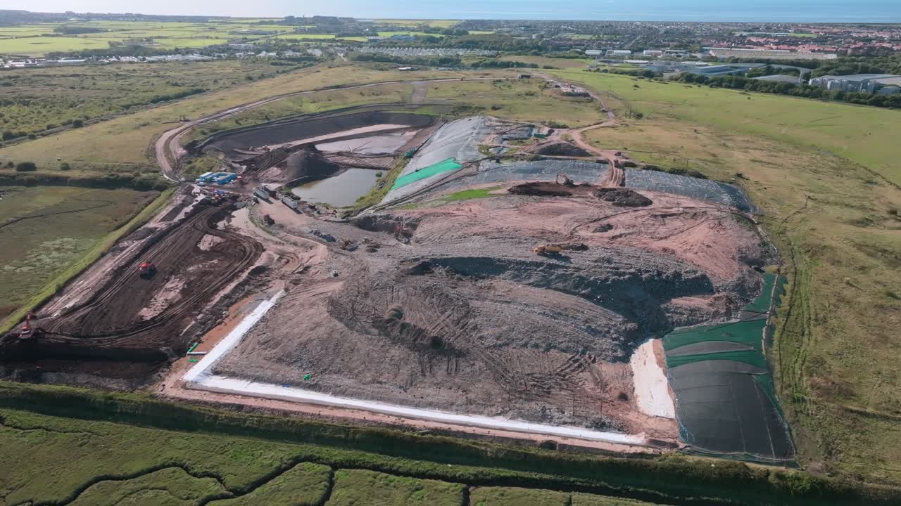 Garbage Landfill Site Next To River Wyre With Coast Visible In Distance. Jameson Road Landfill And Recycling Site, Fleetwood, UK