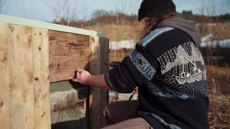 Diy-Hot-Tub,-Man-Screwing-Wood-Plank-With-Cordless-Screwdriver-Outdoor