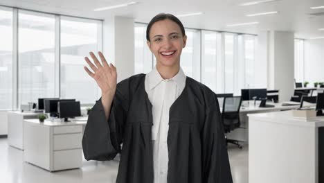 happy indian female lawyer saying hello