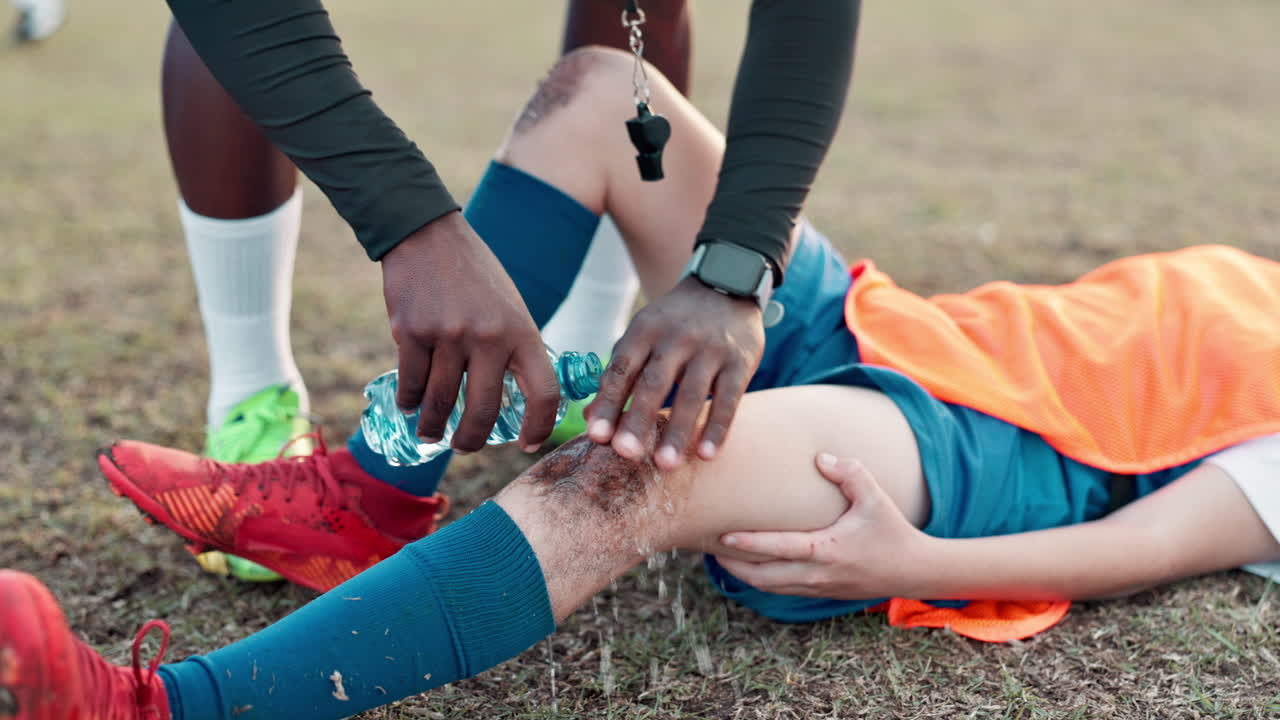 Soccer Player Receives First Aid After Injury