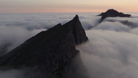 Aerial-view-of-Segla-mountain-above-the-sky,-Norway-during-summer