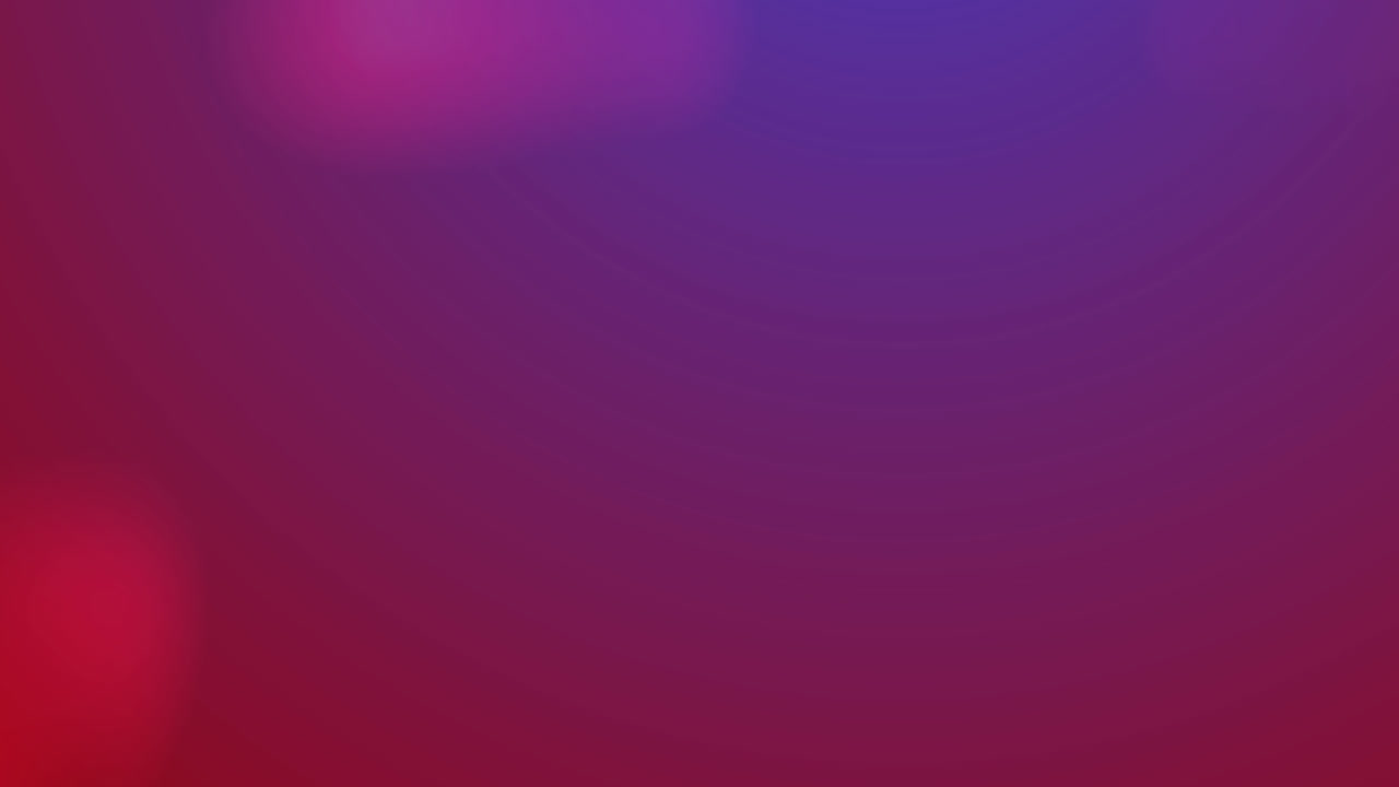 Digital animation of spots of light moving against pink and purple gradient background