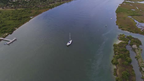 zoom in shot of sailboat with one big mast florida, america