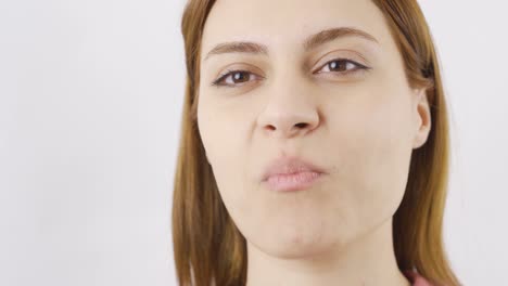 woman eating chocolate in close-up. eating chocolate.