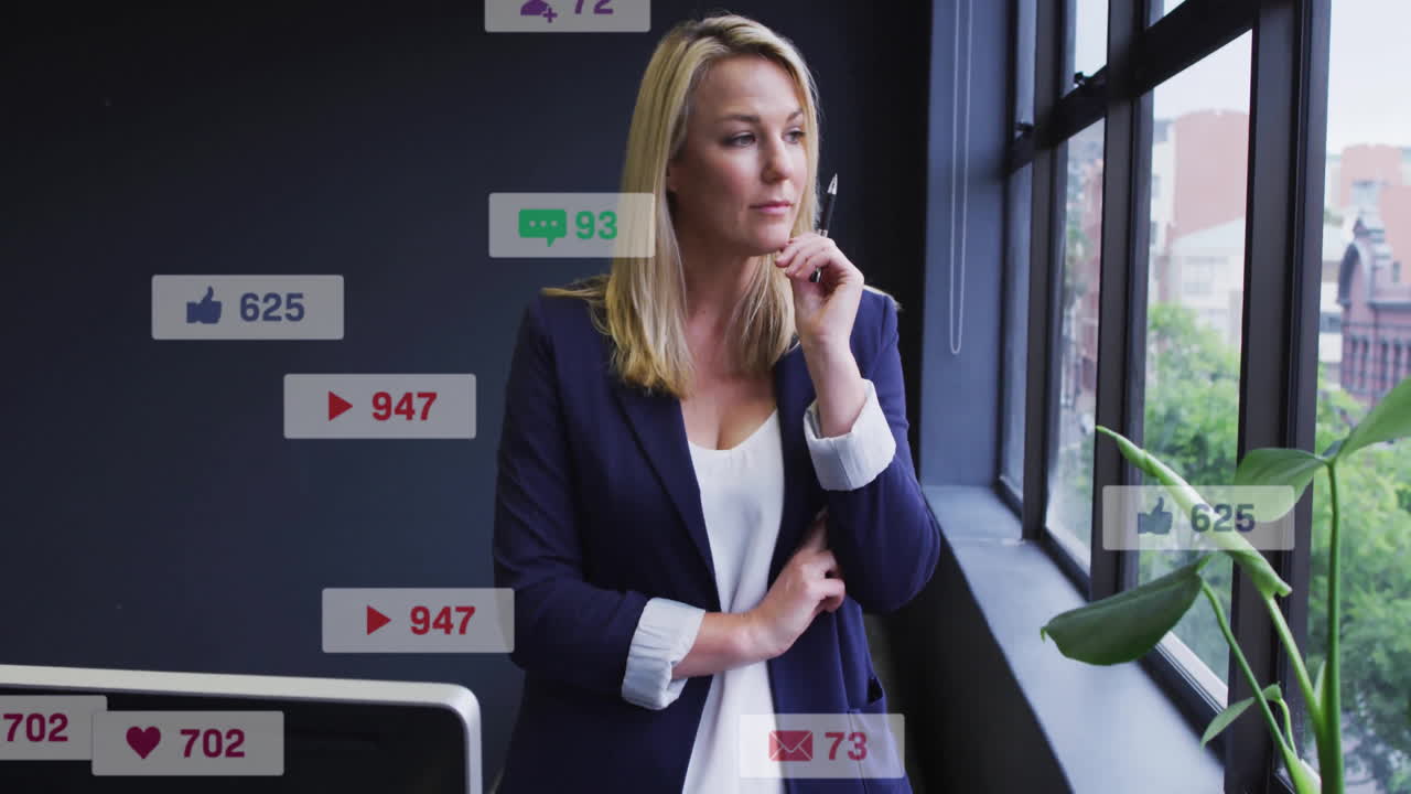 Animation of icons and numbers over caucasian businesswoman in office