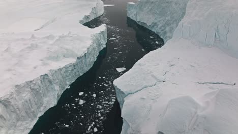 drone over sea and ice of ilulissat icefjord