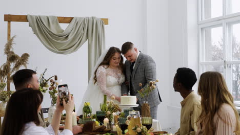 Bride-and-groom-cutting-the-wedding-cake