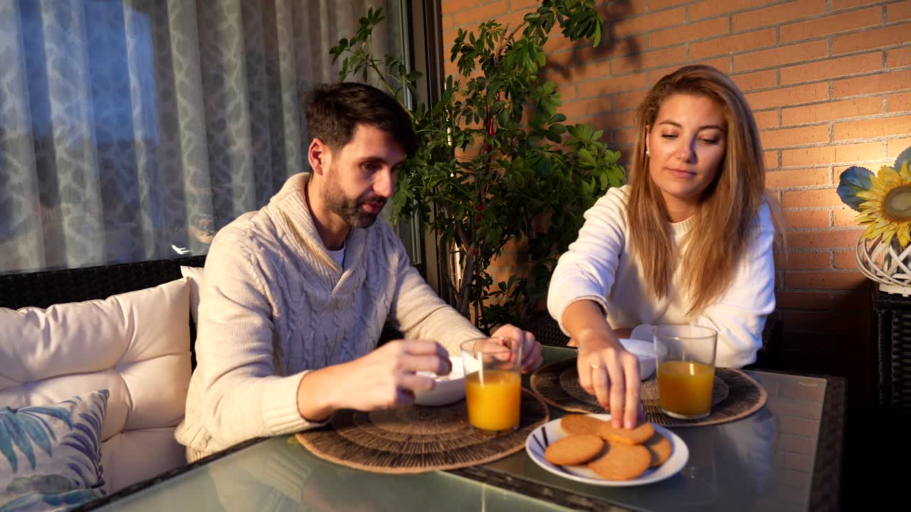 Couple enjoying breakfast on the terrace