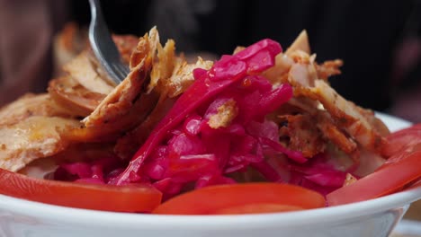 close-up of a bowl of doner kebab with salad