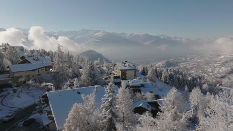 aerial shot in switzerland over the town of crans montana, valais