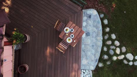 viewing a table set for breakfast from a high vantage point , situated at a nature-immersed resort