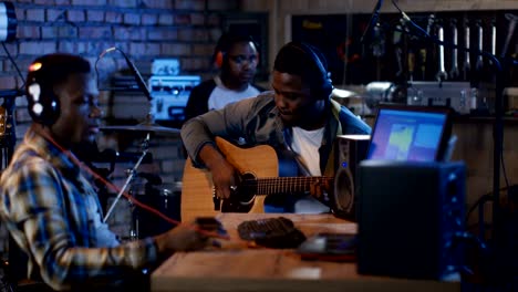 young musicians playing in home studio