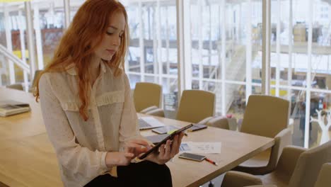 female executive using digital tablet in office 4k