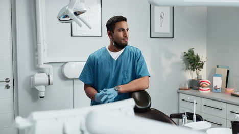 smiling dentist standing in a dental office