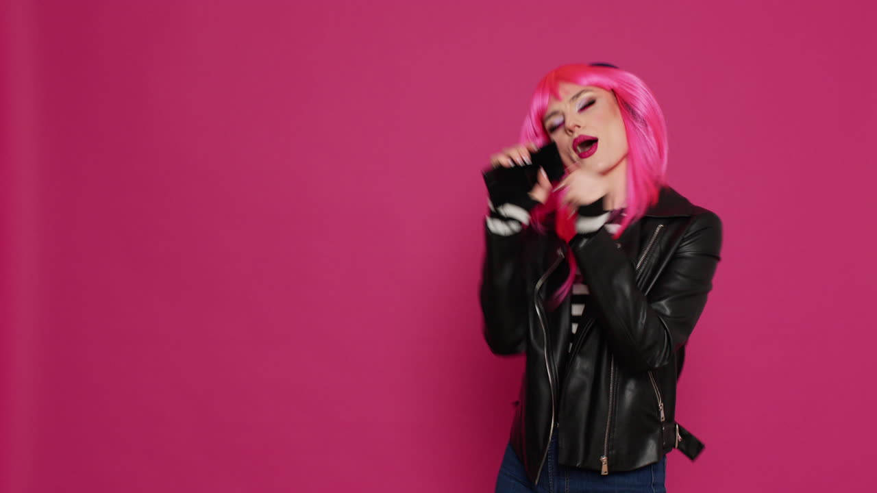 Beautiful hipster girl listening to music on headphones