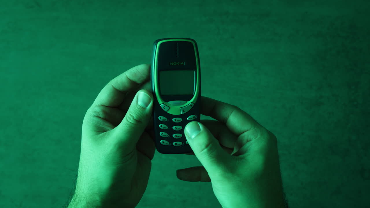 Vintage Nokia Mobile Phone in Hands