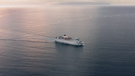 high speed cargo-passenger ferry in the atlantic ocean in the evening at sunset