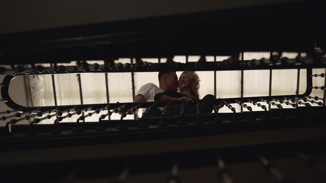 Couple sharing a moment on a staircase