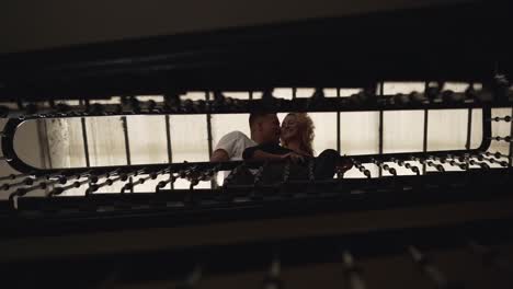 couple sharing a moment on a staircase