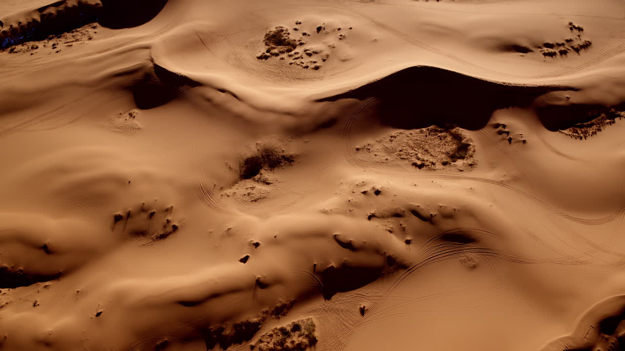 From above, the pink sand dunes of southern Utah form mesmerizing shapes in a surreal landscape.