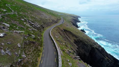 drone view of slea head drive winding above high cliffs and the atlantic ocean early morning in kerry ireland epiclocation