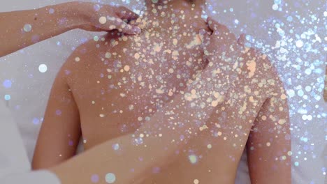 animación de puntos de luz sobre mujer caucásica en el spa