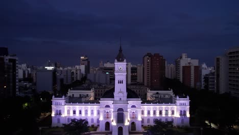 revealing aerial of municipal palace and city council of la plata city capital at night, buenos aires
