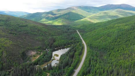 4k drone video of mountains along chena hot springs road near entrance of resort outside fairbanks, alaska in summer