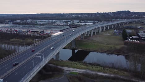 mersey gateway toll bridge highway traffic driving across river estuary aerial static view