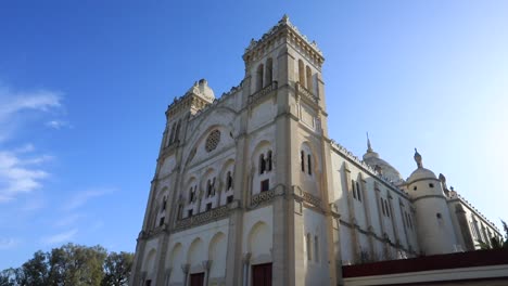 Bright-blue-sky-over-the-grand-Carthage-cathedral-in-Tunis,-vibrant-architectural-details