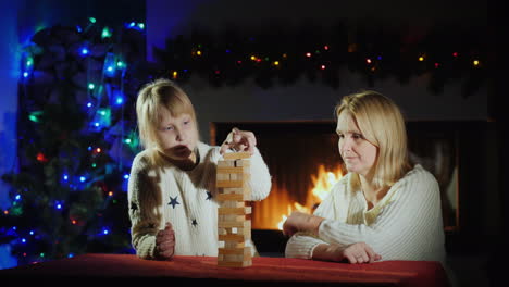 christmas holidays together - mother and daughter play a board game