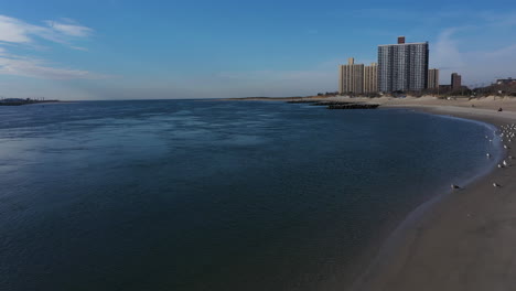 A-drone-view-of-a-quiet-beach-on-a-sunny-day