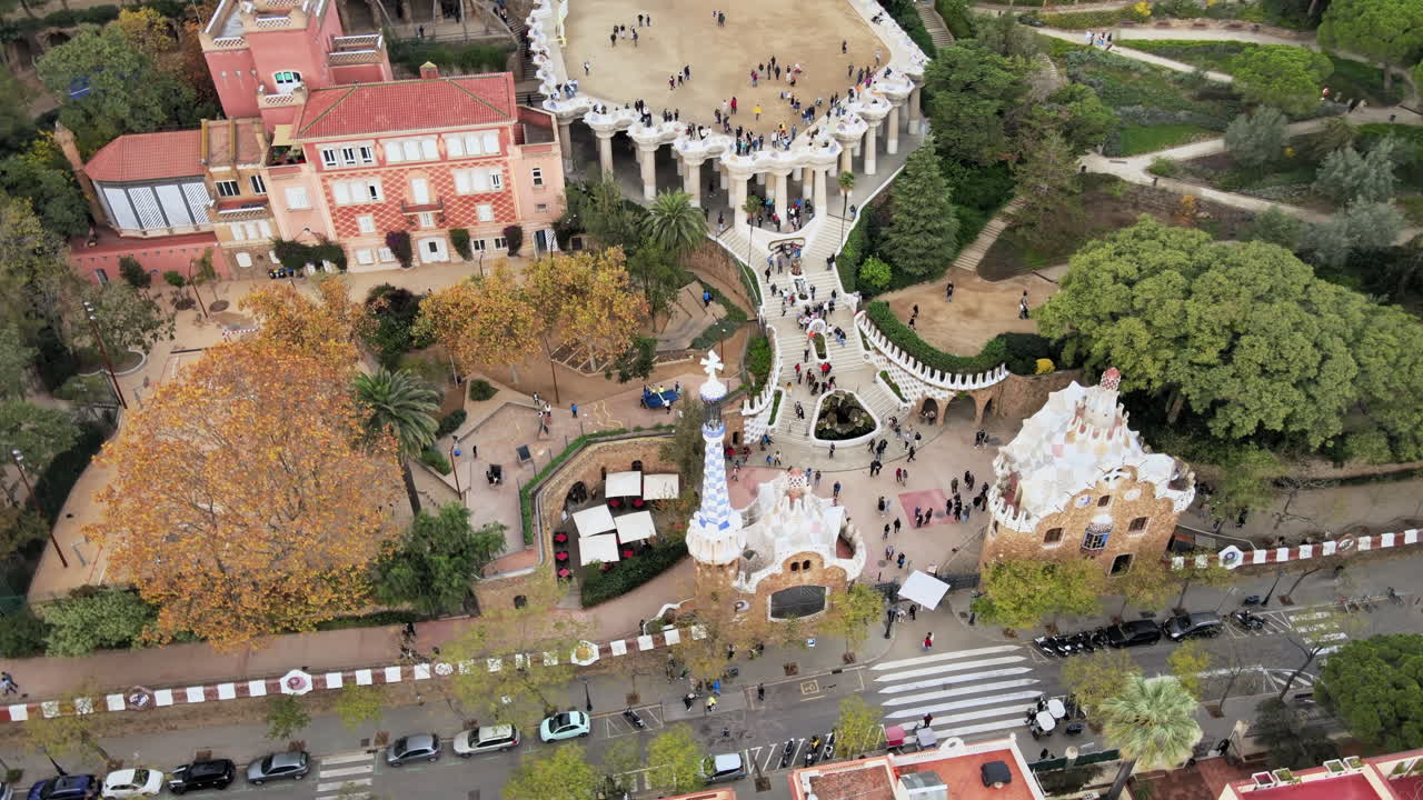 Aerial drone view of Barcelona, Spain. Park Guell with tourists, a lot of greenery