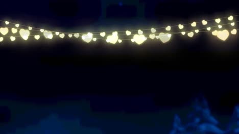 animation of glowing fairy lights over black background