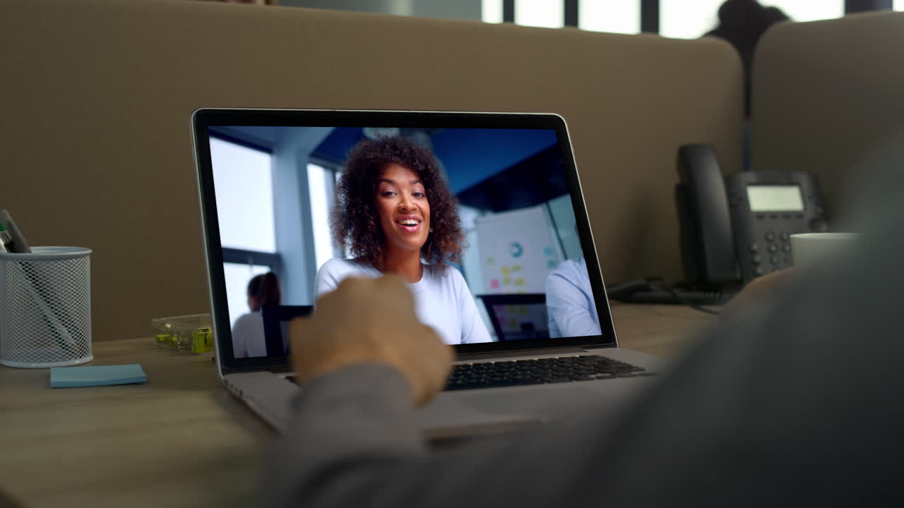 Office manager laptop calling to colleague at workplace closeup