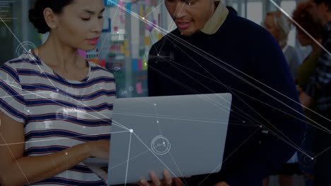 animation of network of connections over diverse male and female office colleagues discussing
