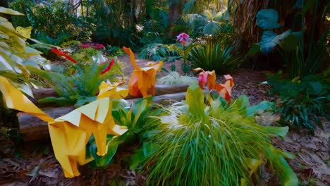 origami cats in a tropical garden