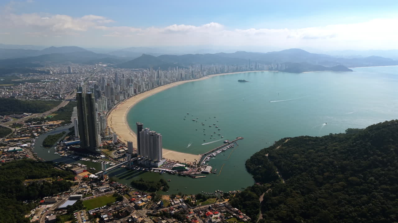 Establishing Drone fly Balneario Camboriu, Brazilian beach City in Santa Catarina, resorts in Coastal mountain landscape