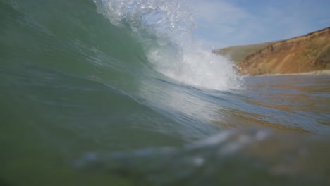 barrel shot of wave crashing