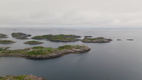 aerial establishing overview of coastal football pitch in henningsvaer, lofoten norway