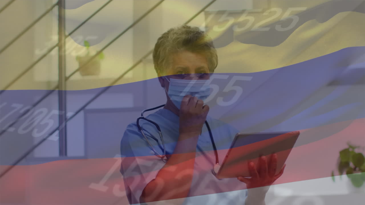 animación de la bandera de colombia y estadísticas con una doctora con una tableta quitándose la máscara