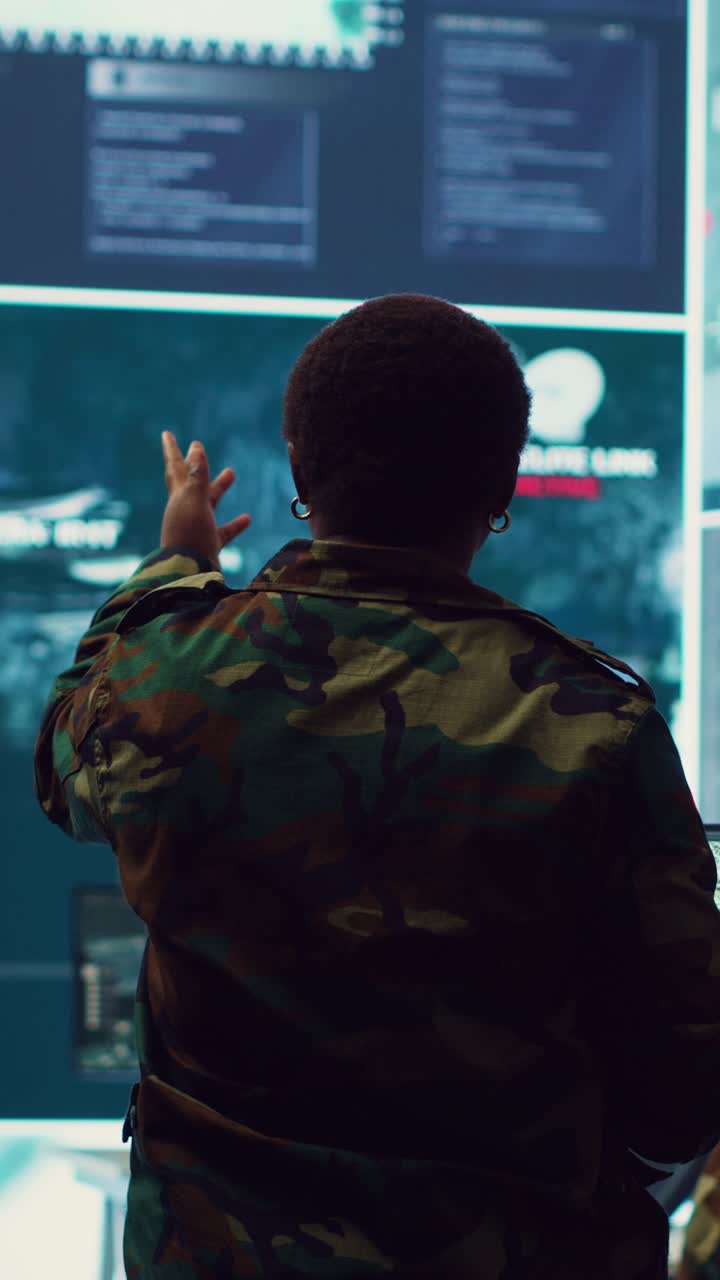 Soldier Monitoring Data on Large Screens in Control Room